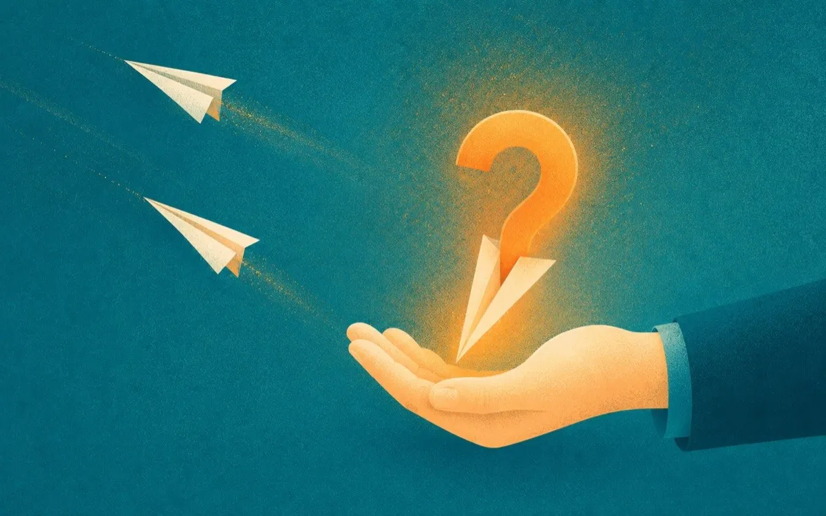 A hand calmly catching a question-mark paper dart while others fly past, a metaphor for handling hard questions in a presentation